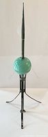 Full view of lightning rod showing spear, glass ball, and tripod base