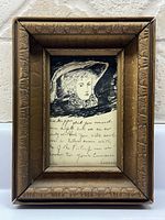 Full view of framed portrait and note