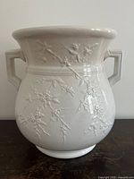 Full view of white ironstone floral slop bucket