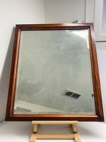 Front view of mahogany framed beveled mirror