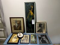 Group shot showing all eight framed portraits and prints