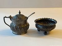 Mustard pot with spoon and separate footed dish