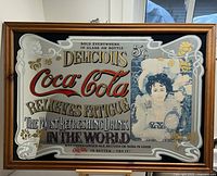 Full view of framed Coca-Cola advertising mirror