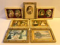 Group shot of all seven carved wood frames with miniature prints