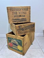 Stacked view of three branded wooden crates
