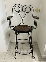 Full front view of wrought iron bar stool
