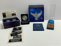 All coins and presentation materials laid out