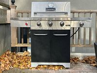 Front view of Cuisinart Gourmet propane barbecue showing control panel, burners and cabinet