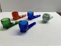 Front angled view of all five coloured glass pipes