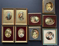 Group shot of nine framed miniature portrait prints arranged on dark background