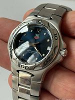 Front view of watch showing dial, bezel, bracelet