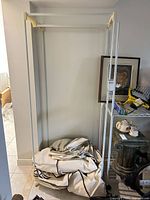 Wardrobe frame assembled with folded cover at base