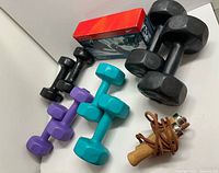 Four pairs of dumbbells, boxed Life Gear set, leather skipping rope