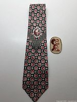 Full view of silk tie and fabric patch on white background