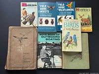 All seven books laid out showing front covers