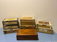 All eight cigar boxes grouped together