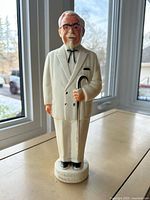 Full front view of Colonel Sanders plastic bank