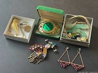 Group shot of entire lot showing belt buckle, boxes with cufflinks and assorted jewelry, brooch, earrings