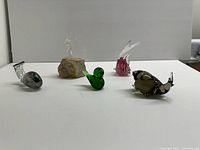 Group view of all five glass animal figurines
