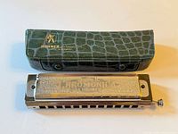 Hohner Super Chromonica harmonica front with case
