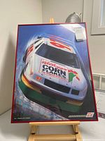 Full view of the poster on easel showing overall design and size