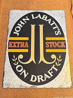 Full view of glass mirror sign showing overall design and size