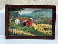 Front view of framed oil painting showing full rural scene