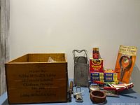 Overall shot showing Libby crate, jar ring boxes, jar lifter, grater, mould and tools