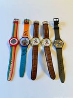 Five watches laid out side by side