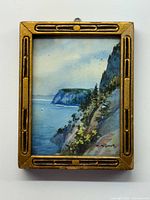 Front view of framed miniature watercolor landscape