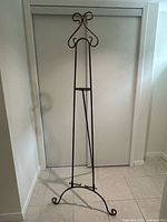 Full front view of wrought iron floor easel