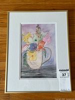 Full view of framed watercolour showing artwork, mat and gold frame