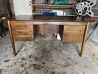 Front view showing drawer configuration and legs