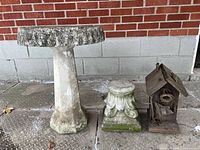Group shot of birdbath, plant stand, birdhouse