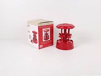 Cherry pitter beside original box