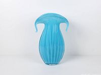 Full front view of sky blue cased white art glass vase