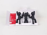 Front view of three black Buddy wall hooks with hardware pouch