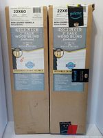 Two boxed Lotus WindOware 22x60 cordless faux wood blinds