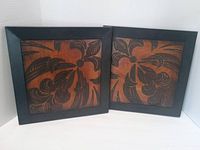 Front view of both framed embossed panels