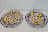 Front view of both hand painted plates