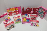 All items grouped: LOVE sign, boxed and bagged Valentine toys and cards