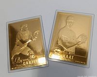 Front view of both Jim Kaat and Gary Carter 22k gold cards in sleeves