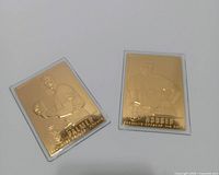 Front view of both gold cards showing embossed player images and names