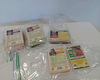 Stacks of baseball cards in plastic bags showing card backs