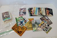 Wide view of assorted baseball cards spread out and stacked