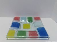 Top view of square fused glass dish with colored inserts