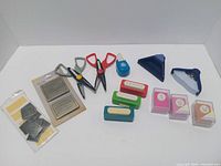 Full lot overview showing scissors, punches, packaged items