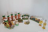 Overall lot layout showing all Easter figurines and decorations