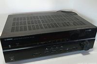 Front view of Yamaha RX-V377 receiver showing display and controls