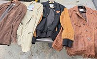 All four jackets laid out side by side